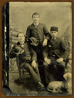 Young men add a touch of dignityor nonchalanceto their image by posing with cigars in their mouths, late 1800s.