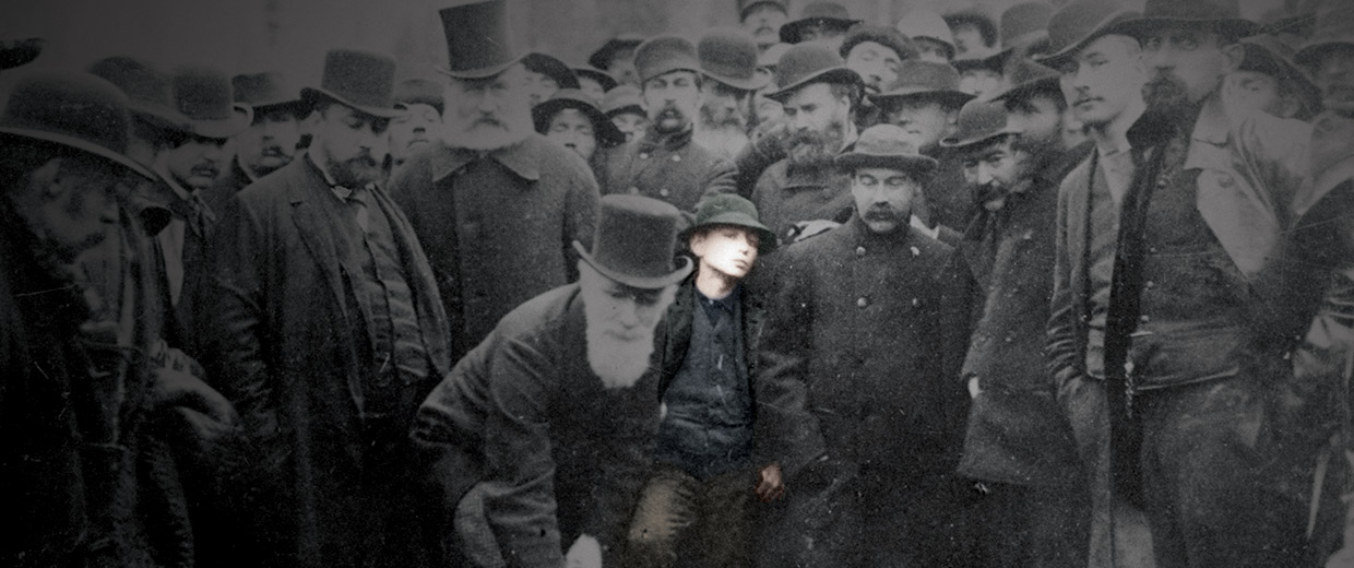 A man is standing in front of a crowd of people